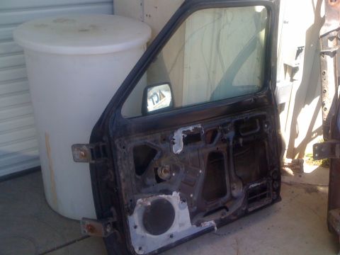 1992 Ford Ranger - Removed 1992 Ford Ranger door, interior view. Part is detached from the vehicle.
