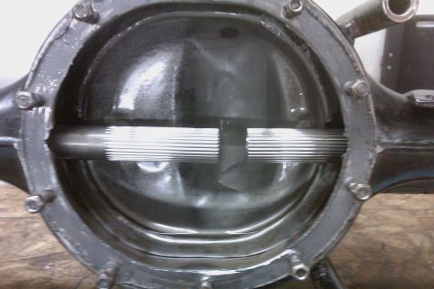1999 Chevrolet Camaro - Close-up view of a differential housing, showing the splined ends of the axle shafts.