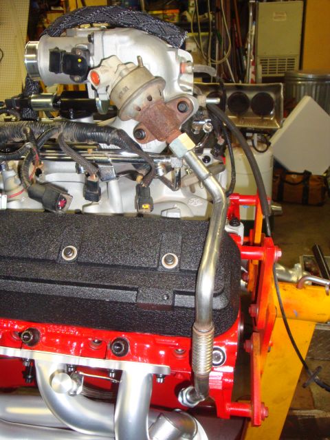 1989 Ford Bronco - Close-up view of an engine's fuel pressure regulator and intake manifold assembly, possibly for a Ford Bronco.