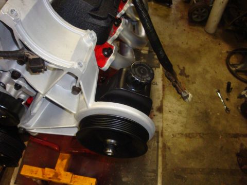 1989 Ford Bronco - Close-up view of an engine's pulley system and power steering pump.