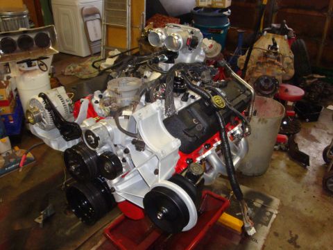 1989 Ford Bronco - A disassembled V8 engine is shown, with various components attached and wiring harnesses visible.