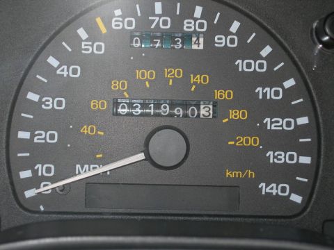 1993 Ford Taurus - Close-up of a car's speedometer and odometer with 319,903 miles.