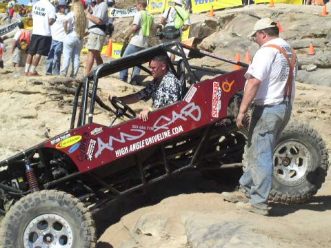 1979 Ford Bronco - A man steers a custom-built off-road buggy during an event.