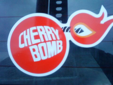 1995 Ford Bronco - Cherry Bomb sticker applied to the rear window of a vehicle.