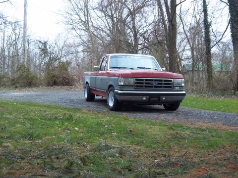 1989 Ford F-150 - This 1989 Ford F-150 pickup truck is shown from a 3/4 front view on a gravel driveway.