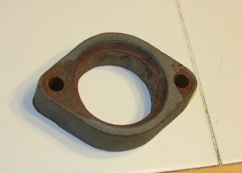 1976 Ford Ranchero - A rusty exhaust flange, likely a replacement part, is shown against a white background.