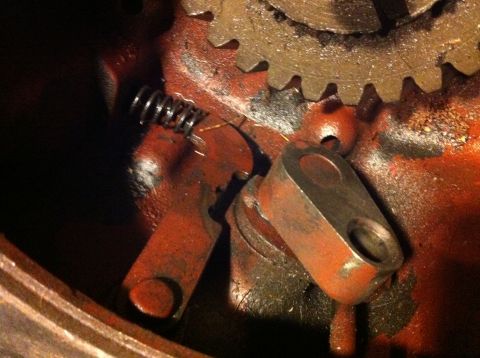 1989 Ford Bronco - Close-up view of the internal components of a transfer case, including gears and a spring mechanism.