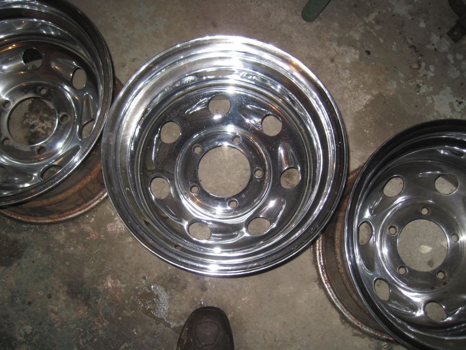 three chrome wheels with five lug holes