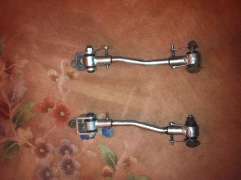 1972 Ford Ranchero - Two suspension stabilizer links are shown against a patterned fabric background.