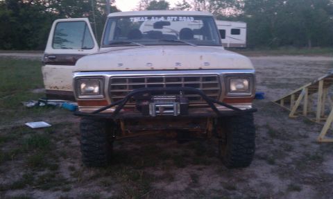 1979 Ford Bronco - This Ford truck has a "Texas 4x4 Off Road" sticker on the windshield and a winch mounted on the front bumper.