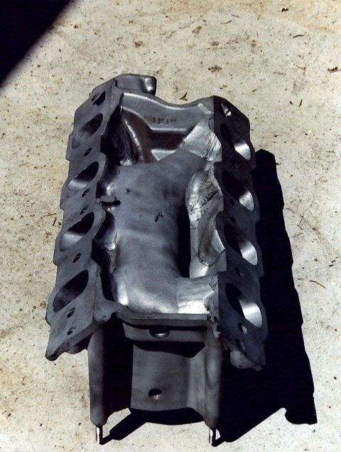 1973 Ford Mustang - A cutaway view of an engine block reveals its internal structure and port openings.