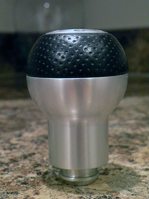2006 Subaru Legacy - This is a Momo shift knob with a textured black grip and a brushed aluminum body.