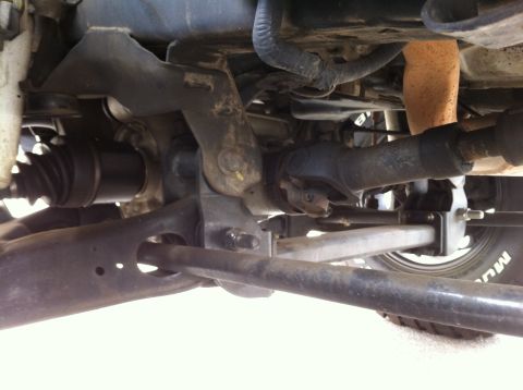 1993 Ford Taurus - Close-up view of the complex mechanical parts beneath a vehicle.