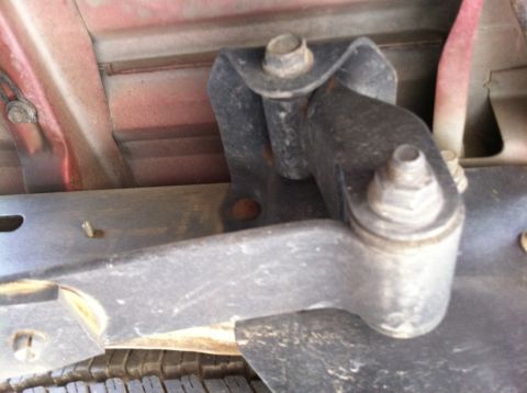1993 Ford Taurus - Underside view of a vehicle's suspension or mounting hardware, showing a bolted bracket assembly.