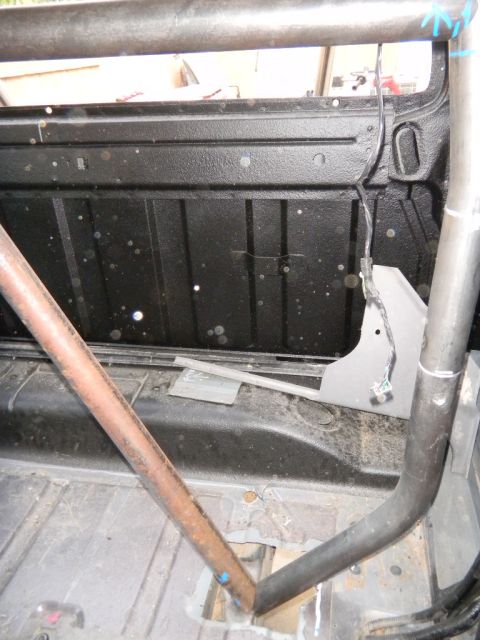 1997 Ford Ranger - Roll cage installed in the bed of a truck, obscuring most of the vehicle's interior details.