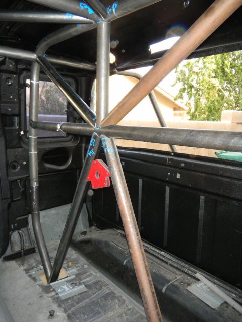 1997 Ford Ranger - Custom roll cage installed inside a truck's interior, obscuring most of the original cabin features.