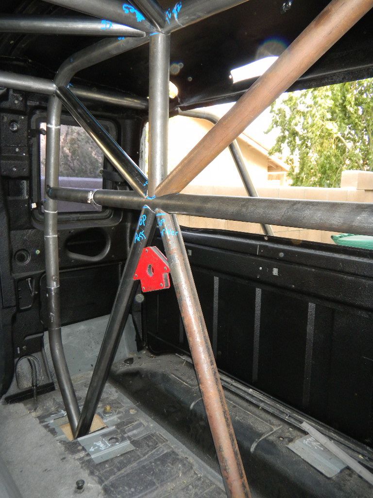 Interior view of a truck cab with a custom roll cage installed