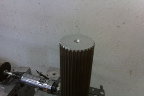 1999 Chevrolet Camaro - Close-up of a splined shaft and a grinding tool, with a website logo in the corner.