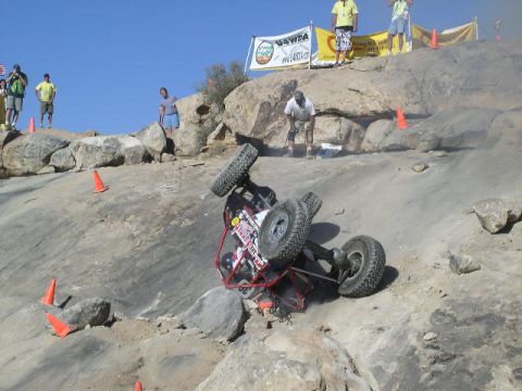 1979 Ford Bronco - An off-road buggy has overturned while navigating a rocky course during an event.