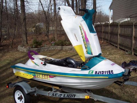 1996 Yamaha RA760 WaveRaider 2-P - 1996 Yamaha RA760 WaveRaider 2-P personal watercraft is shown on a trailer with its hood open.