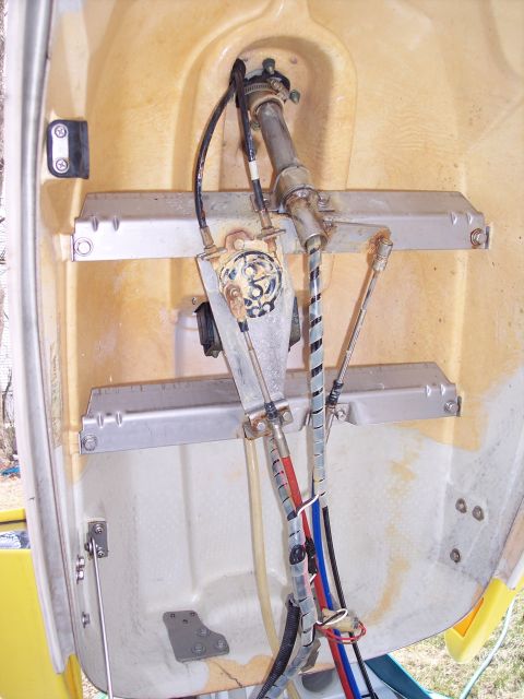1996 Yamaha RA760 WaveRaider 2-P - Internal view of jet ski steering components, showing cables and mechanical linkages.