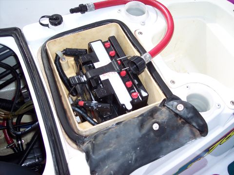 1996 Yamaha RA760 WaveRaider 2-P - Close-up view of a jet ski's battery compartment, showing the battery and associated hoses.