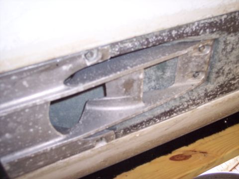 1996 Yamaha RA760 WaveRaider 2-P - Detail of a hull component, likely from a personal watercraft, showing metal construction and a cutout section.