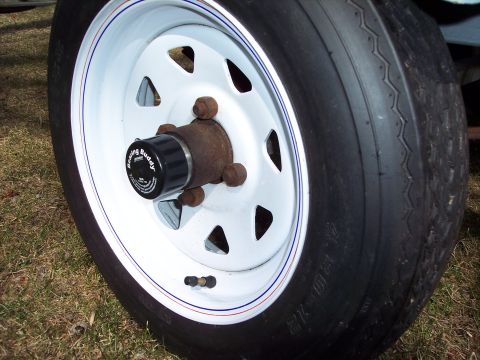1996 Yamaha RA760 WaveRaider 2-P - Close-up of a trailer wheel, showing the hub and tire tread.