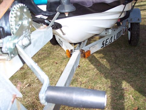 1996 Yamaha RA760 WaveRaider 2-P - Close-up of a jet ski loaded onto a trailer, showing the winch and trailer frame.