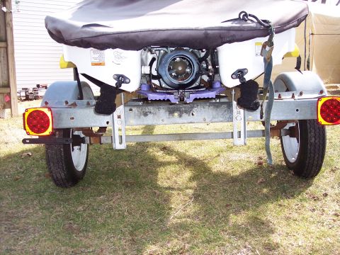 1996 Yamaha RA760 WaveRaider 2-P - Rear view of a jet ski on a trailer, showing the engine and trailer components.