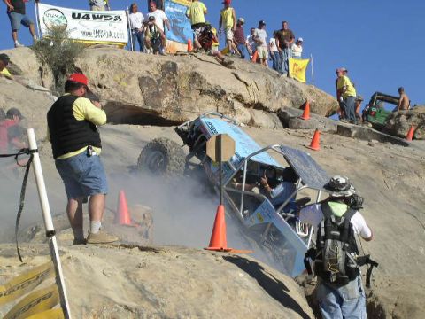1979 Ford Bronco - Spectators watch as a custom buggy navigates a challenging off-road course.