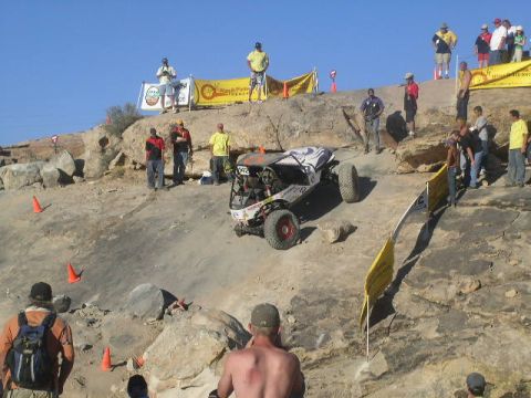 1979 Ford Bronco - A custom off-road buggy navigates a challenging rocky terrain during a competition event.
