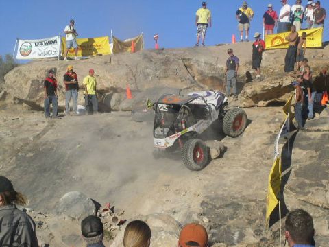 1979 Ford Bronco - A custom buggy navigates a challenging rocky course during an off-road event.