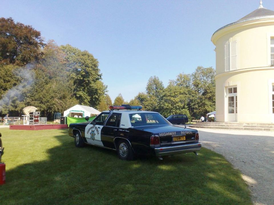 1991 Ford Crown Victoria highway patrol car, rear view, black and white