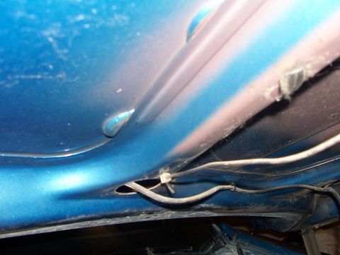 1973 Ford Ranchero - Close-up of a blue car's interior panel, revealing wiring and a SuperMotors watermark.
