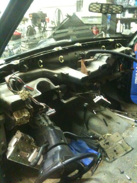 1993 Ford Bronco - Interior view of a 1993 Ford Bronco with the dashboard disassembled for repair or modification.