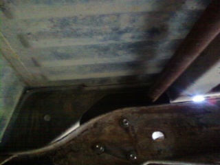 1995 Ford Bronco - Close-up view of the undercarriage, showing structural elements and a website watermark.