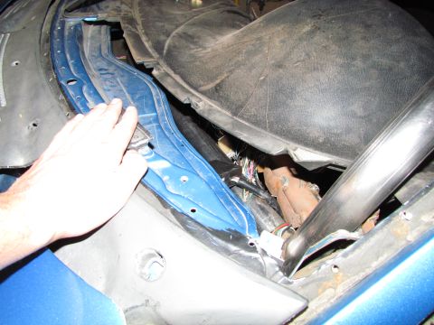 1995 Ford Probe - Exposed wiring harness and structural components visible inside a vehicle's interior.