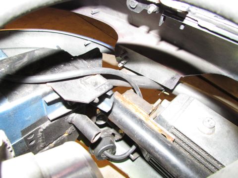 1995 Ford Probe - Detail shot of a vehicle's radiator and associated plumbing, showing wear and tear.