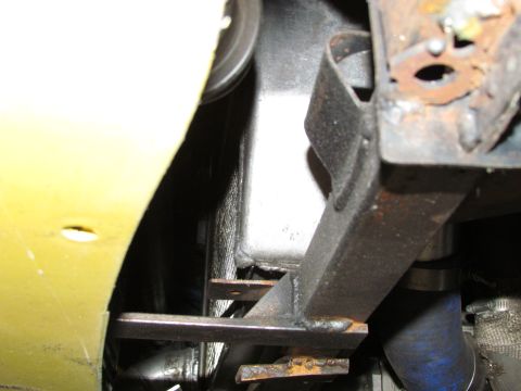 1995 Ford Probe - Close-up view of a car's undercarriage, showing the radiator and frame components.