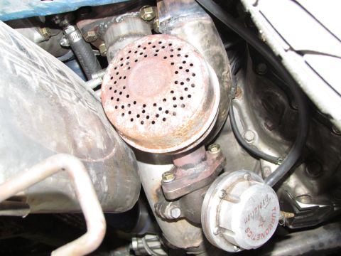 1995 Ford Probe - Close-up view of a turbocharger and wastegate assembly, with visible text indicating 'Evolution'.