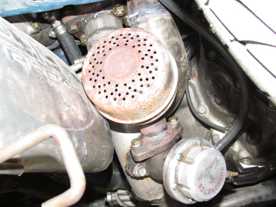Turbocharger and wastegate with 'Evolution' text visible