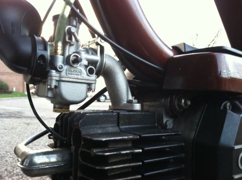 1981 Garelli Rally Sport - A close-up view of a motorcycle's engine components, focusing on the carburetor and cylinder head.