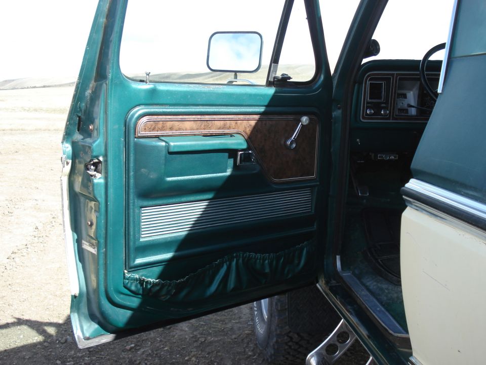 Green interior door panel and dashboard of a 1979 Ford Bronco