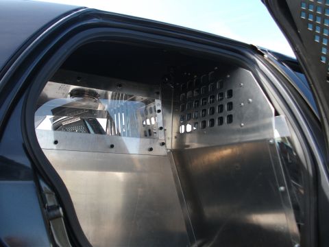 2001 Ford Crown Victoria - Custom partition and cage installed in the rear of a police vehicle.
