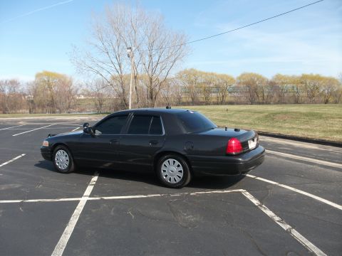 2001 Ford Crown Victoria - This 2001 Ford Crown Victoria is captured from a 3/4 front angle in a parking lot setting.