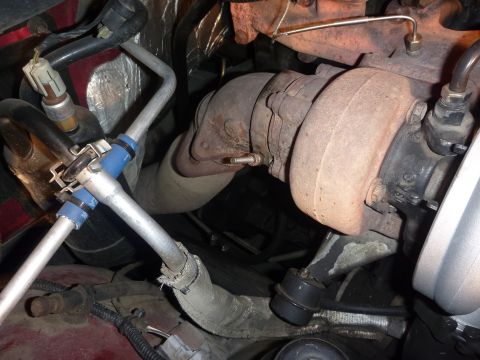1997 Dodge 2500 - Close-up view of engine components, including a turbocharger and exhaust manifold.
