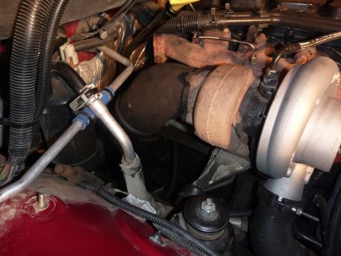 1997 Dodge 2500 - Close-up view of the turbocharger and exhaust manifold within the engine bay.