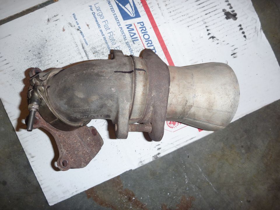 Exhaust manifold with catalytic converter on a Priority Mail box