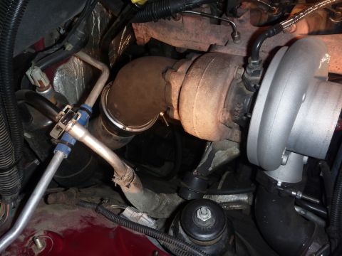 1997 Dodge 2500 - Engine bay view focusing on the turbocharger and exhaust manifold connections.
